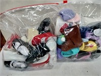 Two bags of doll shoes different sizes