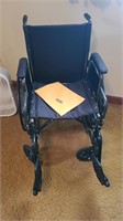 Wheelchair with foot pedals and manual