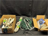 Box of electric cords and power strips, outlet cov