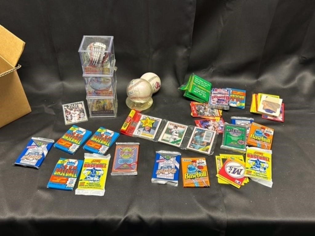 Collectible baseballs several baseball card packs