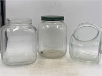 -2 large vintage glass jars one with lid and a