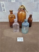 Vintage pink, blue, and brown bottles