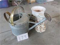 Galvanized watering can, seashells