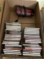 Box of cds and alarm clock