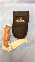 One Gerber brand wood handle knife like new