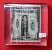 Shrinking Dollar Paperweight