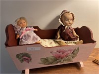 (2) Dolls and Decorated Cradle