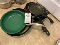 group of 5 frying pans