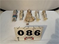 Vintage Porcelain dolls. Some with damage.
