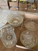 Three clear glass bowls and one clear glass