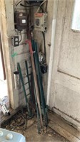 Assorted posts and trimmer in corner