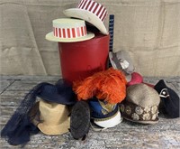 fantastic collection of old hats in blue tub.