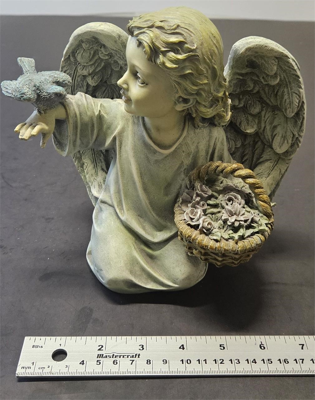 angel with bird decoration