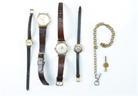 Four wristwatches and two winding keys