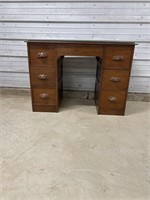 Seven drawer small desk with a glass top can be