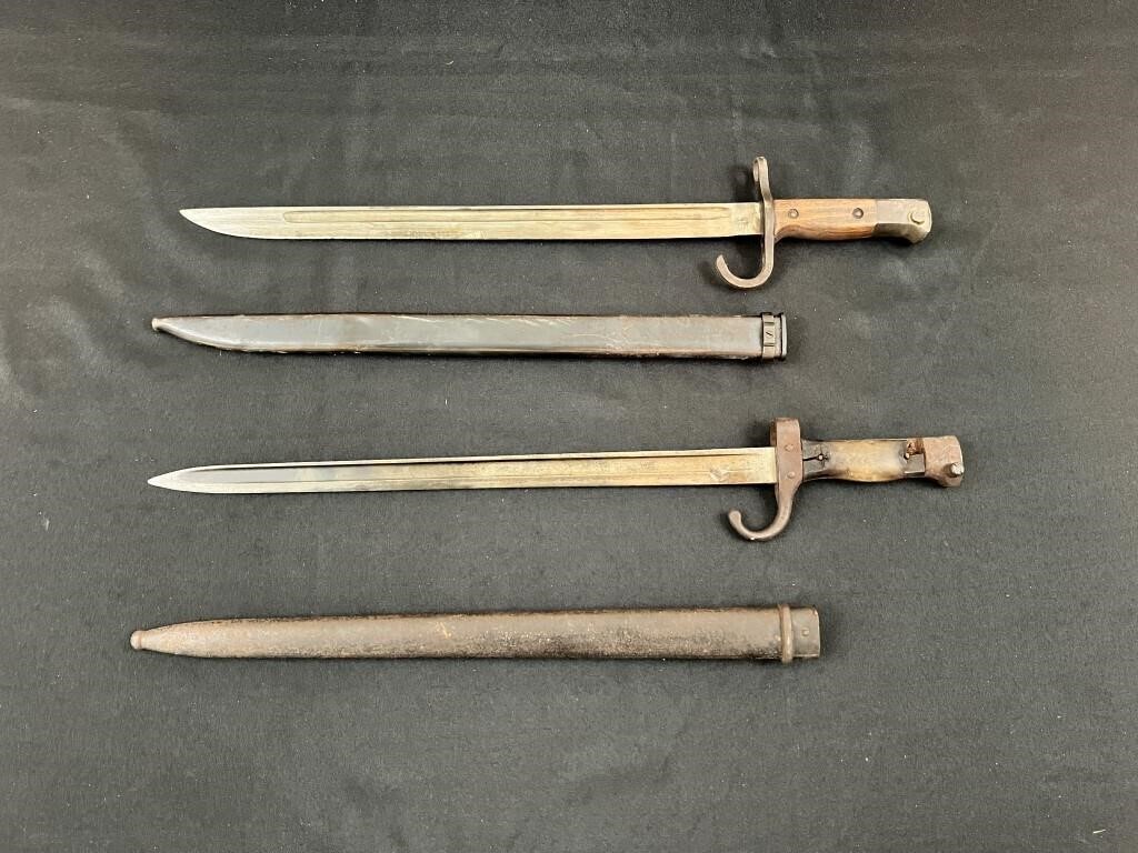 2-bayonets with sheaths.
