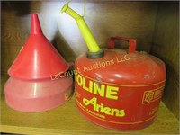 3 gas cans & funnels one metal Ariens