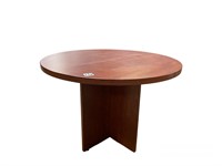 Cherry wood color round table. 47in diameter.