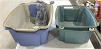 2 plastic litter boxes