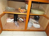 Everything in bottom cupboard right side of stove