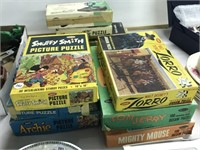 Large lot of vintage puzzles and games