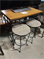 Bar height metal table with 2 upholstered metal
