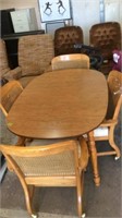 DINING TABLE & 4 ROLLING CHAIRS