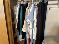 Clothes hanging in closet (M/L)