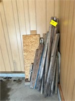 Assortment of wood and stakes in corner