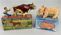 Mechanical Wind-Up Tin Bull & Pig Toys.