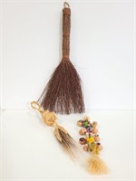 Three decorative small broom art