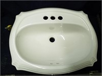 New 23" × 18" top mount sink with light scuffs