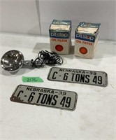 Vintage license plates, oil filters & car