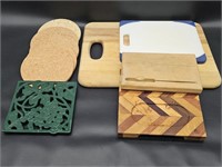 Cutting Boards 3 wood 1 plastic & Trivets 1 cast