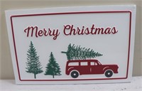 White and red metal Merry Christmas sign