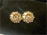 Gold stud earrings marked 14k with jackets