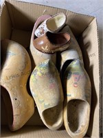 Wooden shoes, two small ceramic shoes and a step