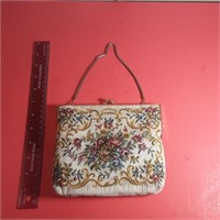 Antique purse with a few necklaces