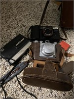 Box of vintage cameras including Olympus, Kodak