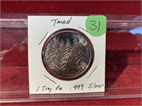 TONED 1 TROY OZ. .999 SILVER ROUND PINE TREES