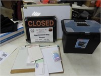 Dry erase board, closed sign, plastic file.