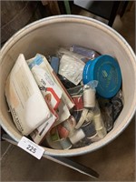 Large container of sewing materials.