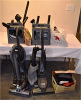 Collection of Kirby vacuums and accessories; as is