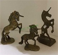 Lot of three brass unicorn figures tallest