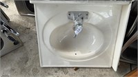 White bathroom sink 25x22