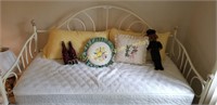 Floral day bed with decorative throw pillows