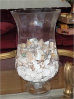 Glass centerpiece filled with shells