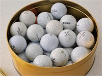 Tin of golf balls