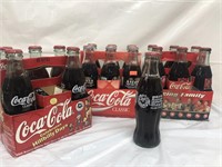 Group of collector Coca-Cola bottles 25th