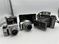 LOT OF 2 DIGITAL CAMERAS AND 1 OLD POLAROID